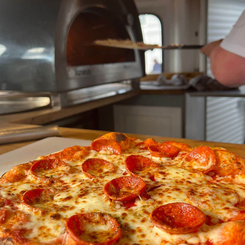 Stone baked pizza fresh out the pizza truck oven